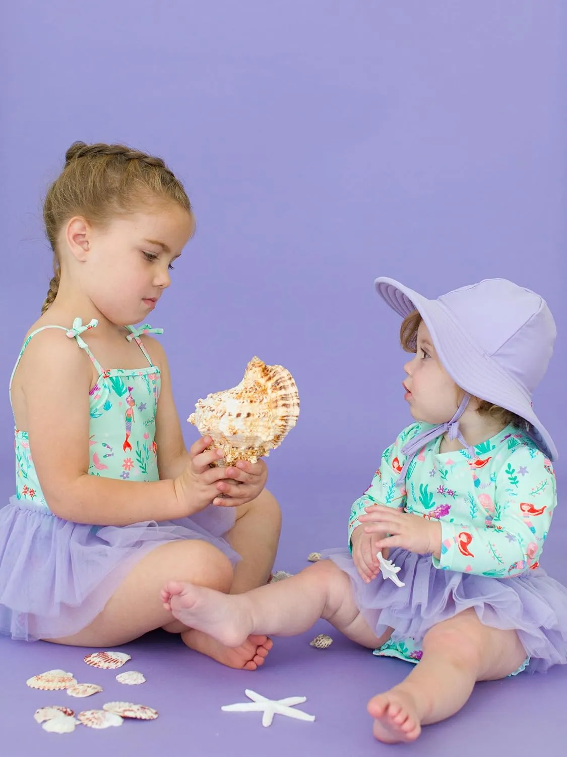 RuffleButts Girls UPF50  Sun Protection Peplum Smocked Bodice/Tulle Skirted One Piece Swimsuit